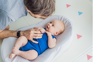 Loving father interacts with his 3, a Person Photo by Elizaveta Galitskaya