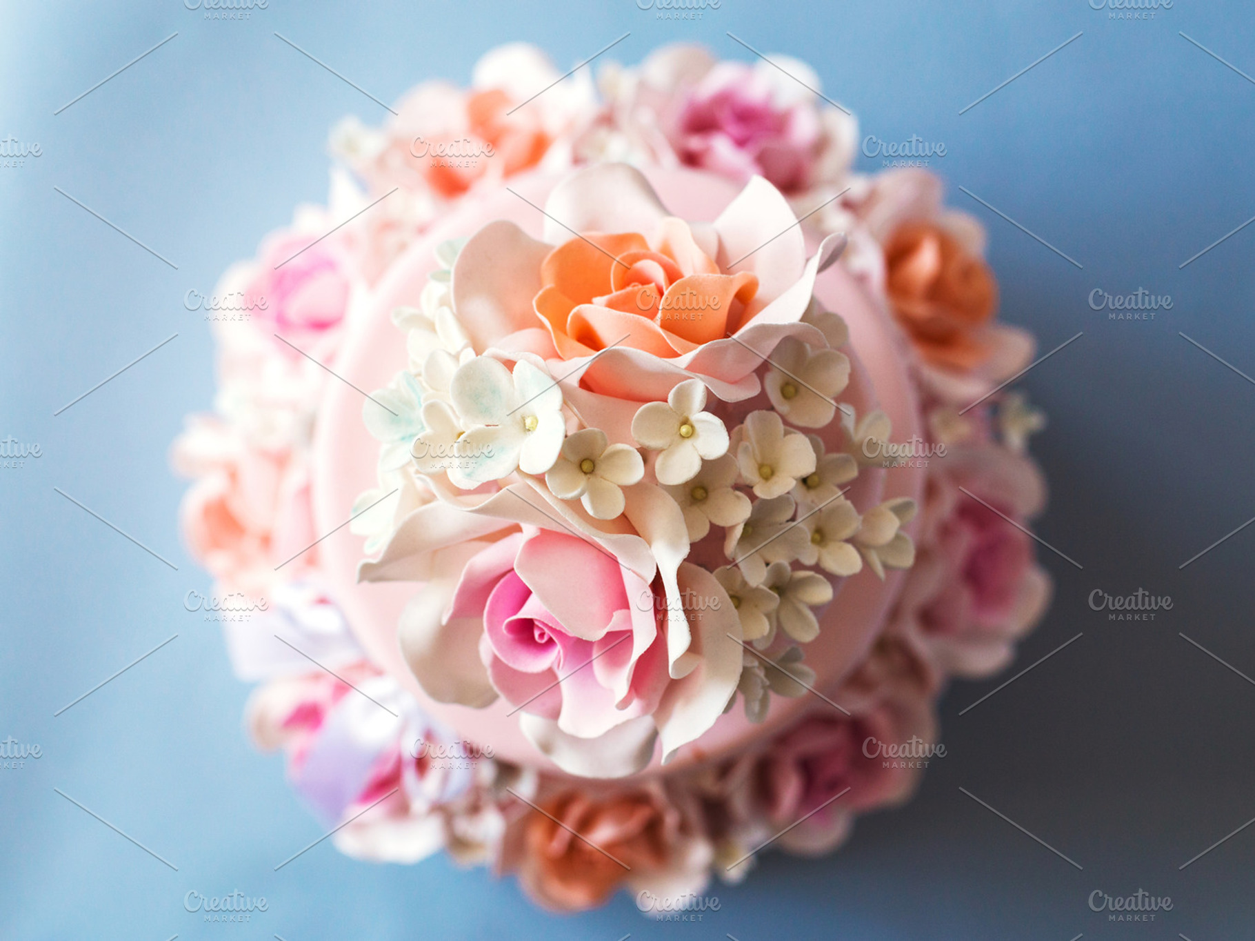 Cake decorated with flowers on a blue background featuring cake, flower, and, a Food & Drink Photo by Olga_Z