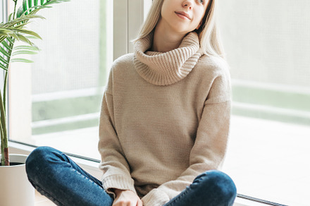 Young caucasian woman relaxes at home, a Person Photo by Olena Rudo