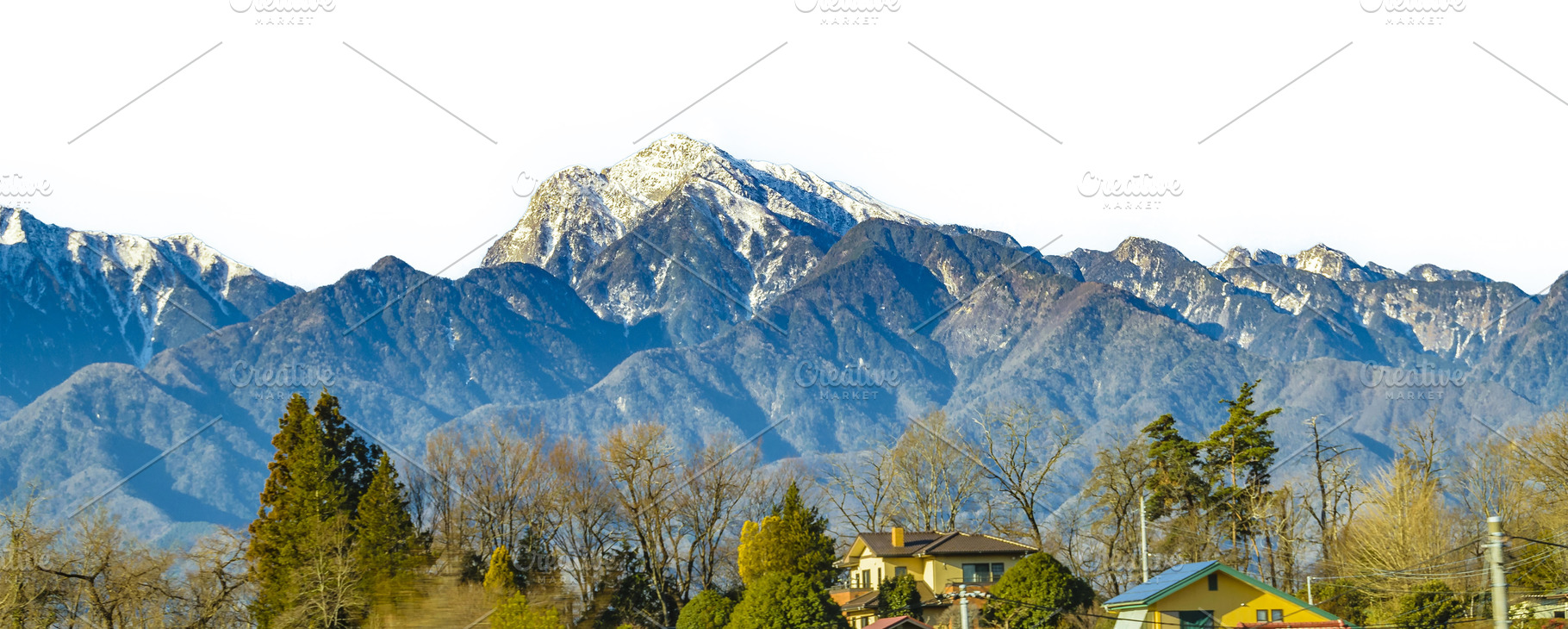 Countryside town with big andes snowy mountains at backgroun iso, a Nature Photo by DanFLCreativo