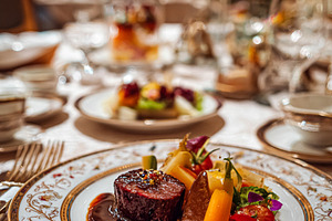 Gourmet fine dining experience plating a tenderloin steak with v, a Food & Drink Photo by Studio ANNA