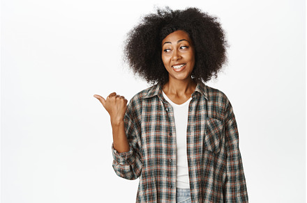 Enthusiastic Black woman pointing, a Person Photo by Cookie Studio