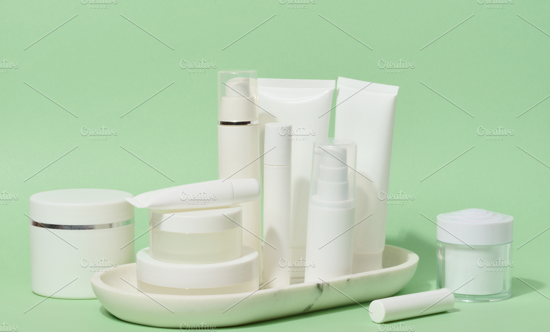 A collection of various white cosmetic containers, including tub, a Beauty & Fashion Photo by ndanko