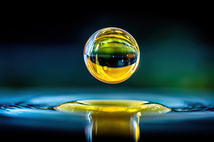 Vibrant macro water droplet, an Abstract Photo by AlyaAnd