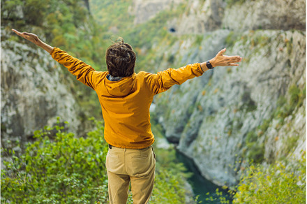 Man tourist in the background of, a Nature Photo by Elizaveta Galitskaya