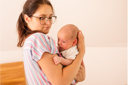 Young tired mother holding her, a Person Photo by oksix