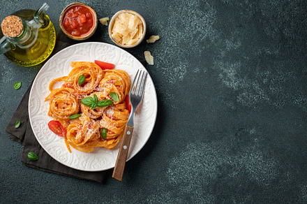 Tasty appetizing classic italian tagliatelle pasta with tomato sauce, cheese pa, a Food & Drink Photo by Budarinphoto
