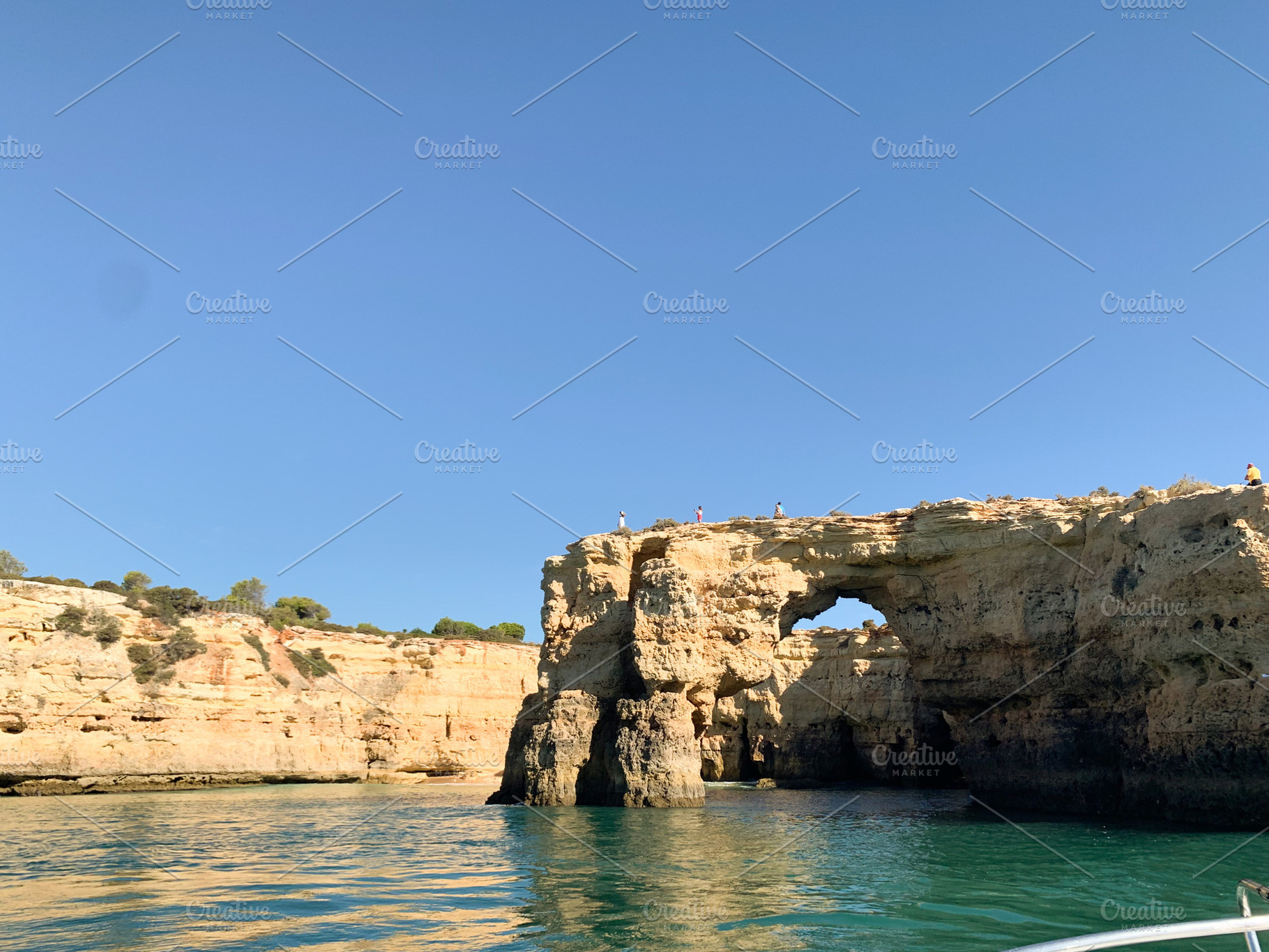 Coastal cliffs of Algarve with natural rock formations and turqu, a Holiday Photo by sebastianaraw