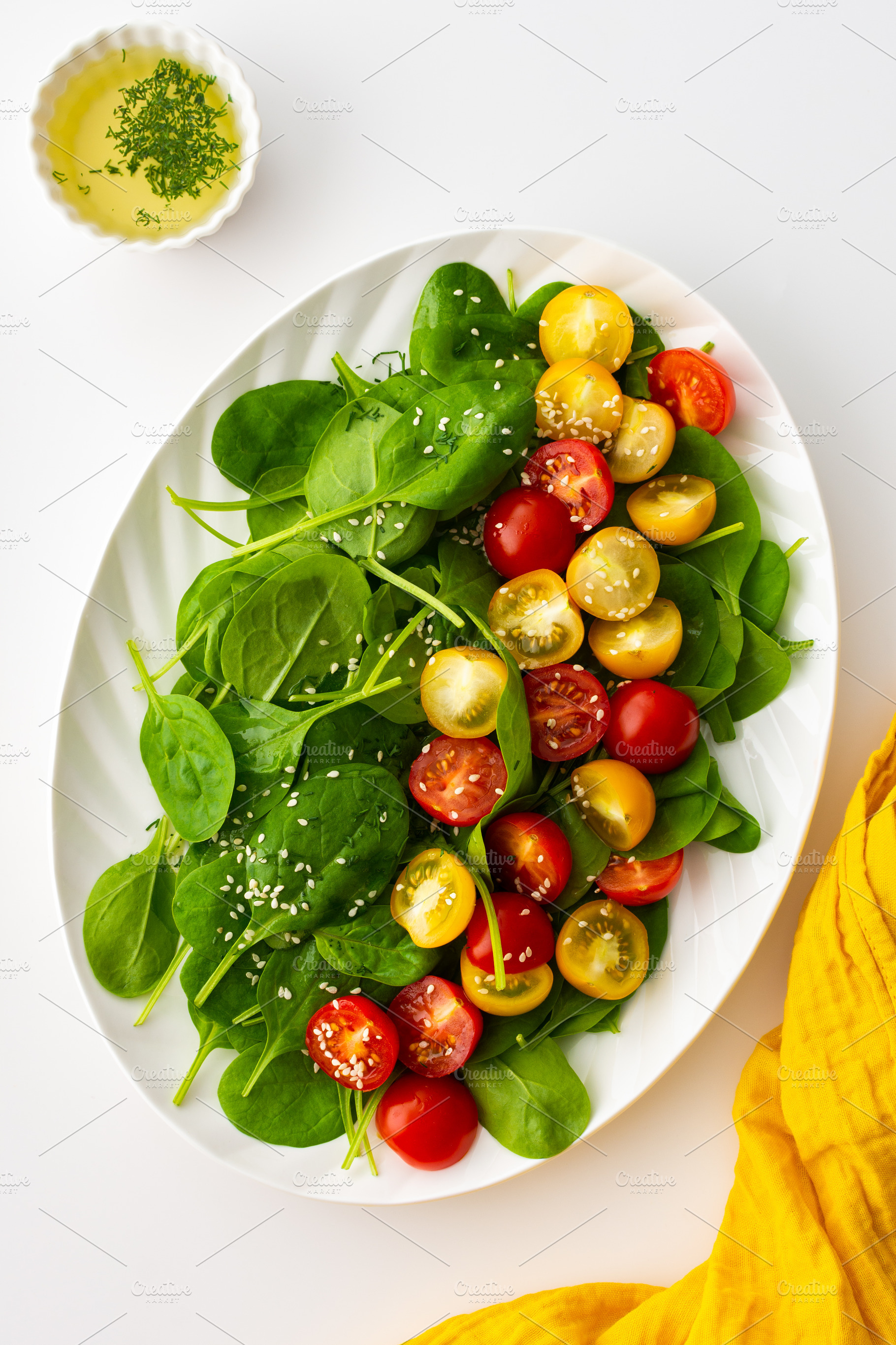 Salad with tomatoes and spinach, a Food & Drink Photo by Pandateam