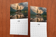 Saddle Stitched Wall Calendar Mockup, a Mockup by Vectogravic Design (Thumbnail 4 of 7)