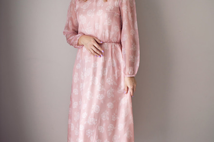 portrait of a fashionable blonde woman in a pink dress and rose flower in her h, a Person Photo by SaulichPhoto