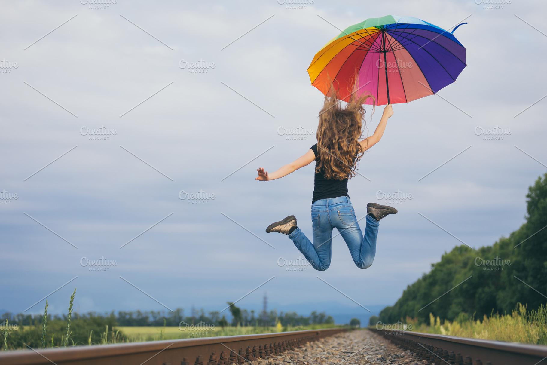 Teen girl with umbrella featuring kid, summer, and happy, a Person Photo by altanaka