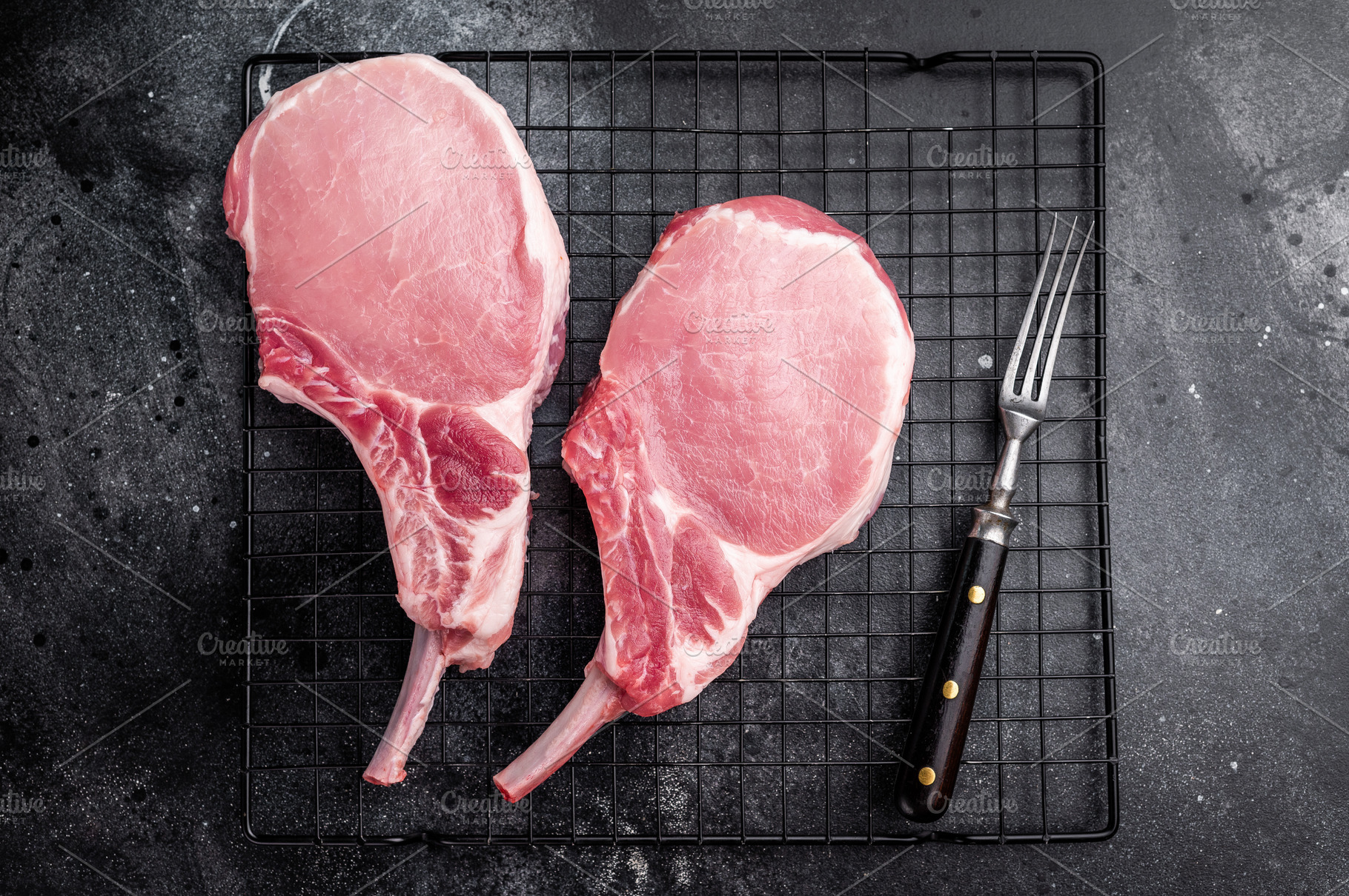 Fresh pork Chop Tomahawk steak, showcasing its impressive bone a, a Food & Drink Photo by composter-box@mail.ru