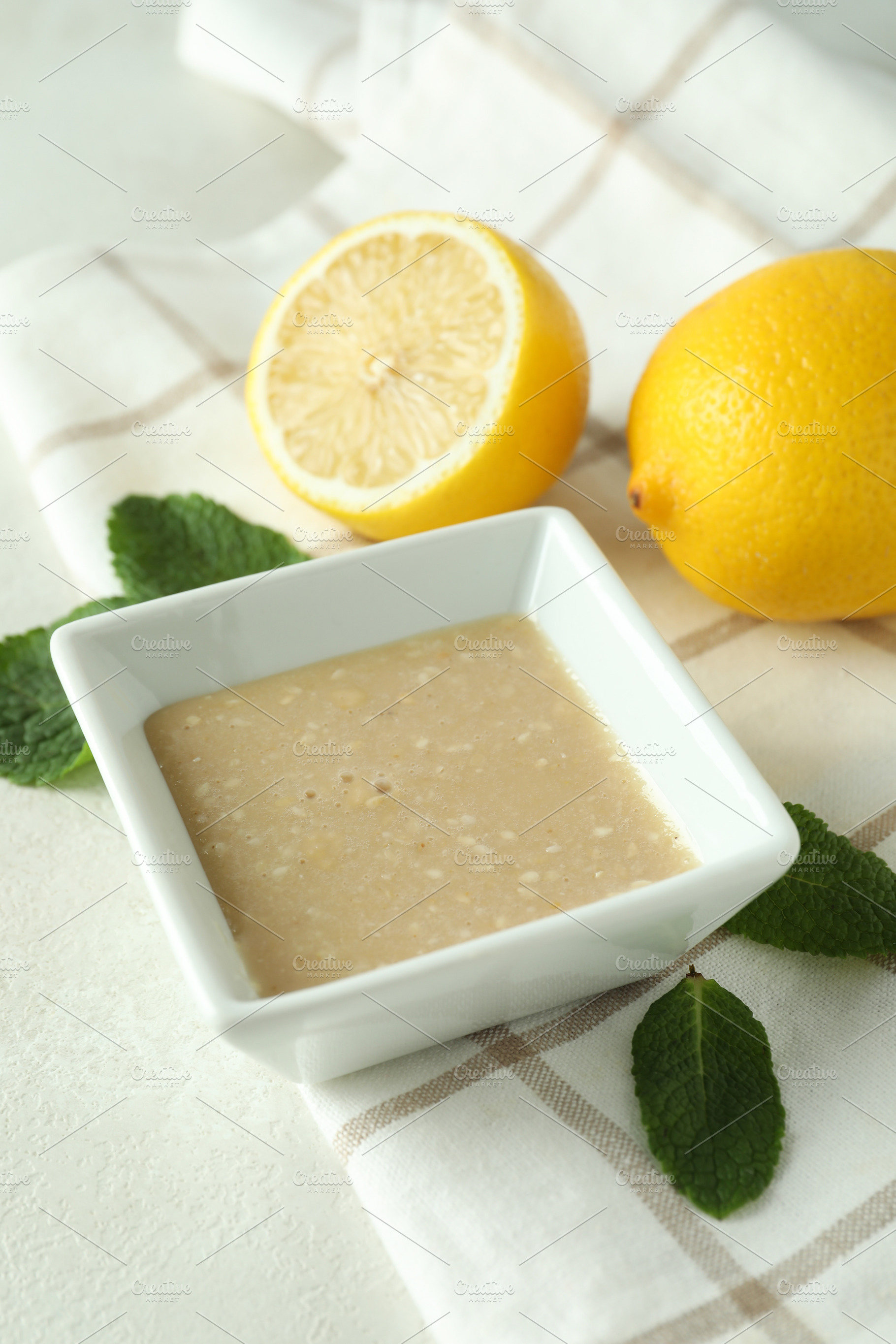 Concept of tasty food with tahini sauce on light texture backgro, a Food & Drink Photo by AtlasStudio PRO