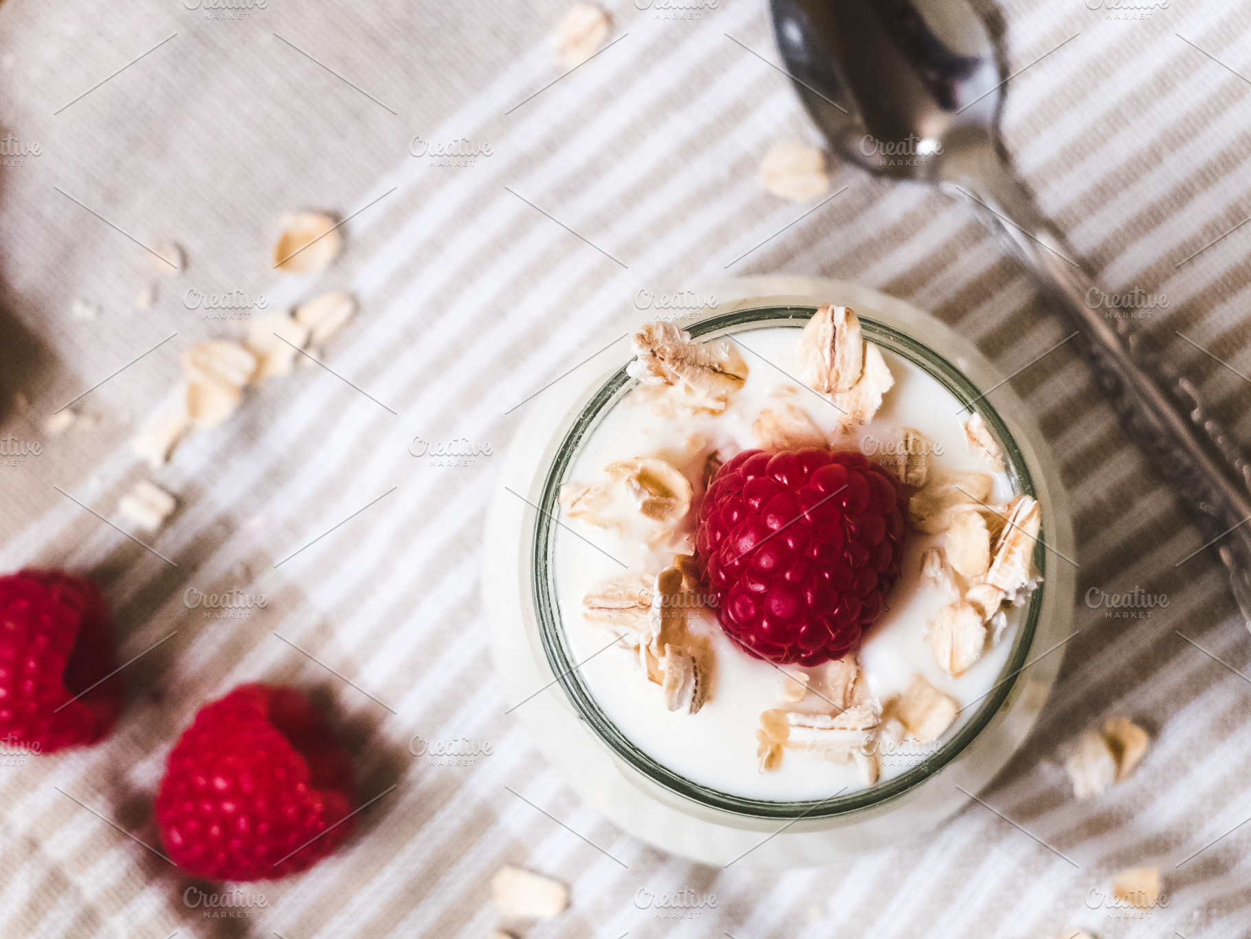 Yogurt with raspberries containing breakfast, food, and fruit, a Food & Drink Photo by Visual Bloom