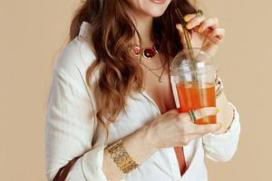 happy elegant 40 years old woman in blouse and shorts on beige, a Person Photo by Alliance Images
