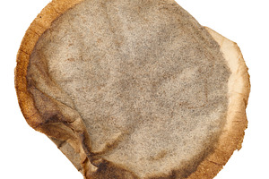 Round coffee pod of ground coffee wrapped in filter paper. Isola, a Food & Drink Photo by ndanko