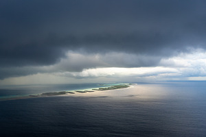 Aerial view of Rangiroa Atoll under a stormy sky, Tuamotus, Fren, a Nature Photo by GoodGoods