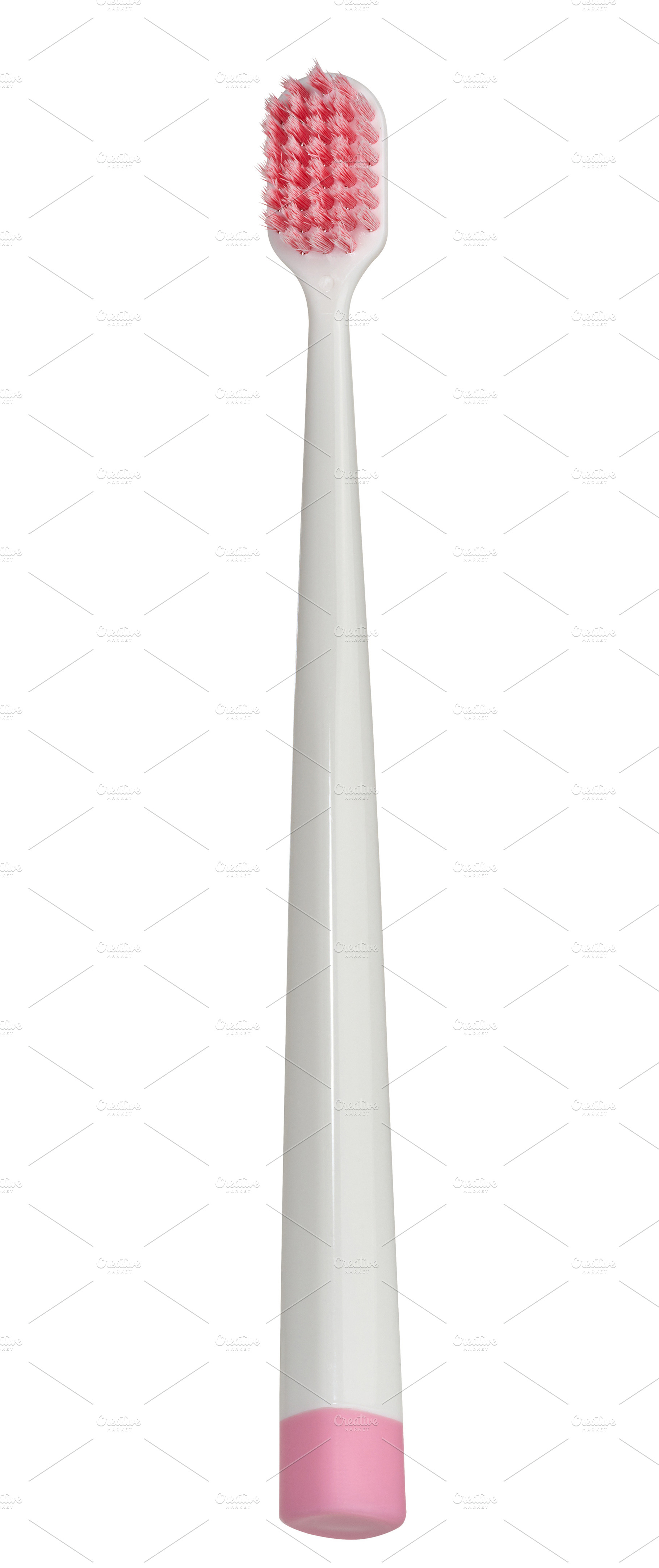 Plastic white toothbrush on isolated background, close up, a Health & Medical Photo by ndanko