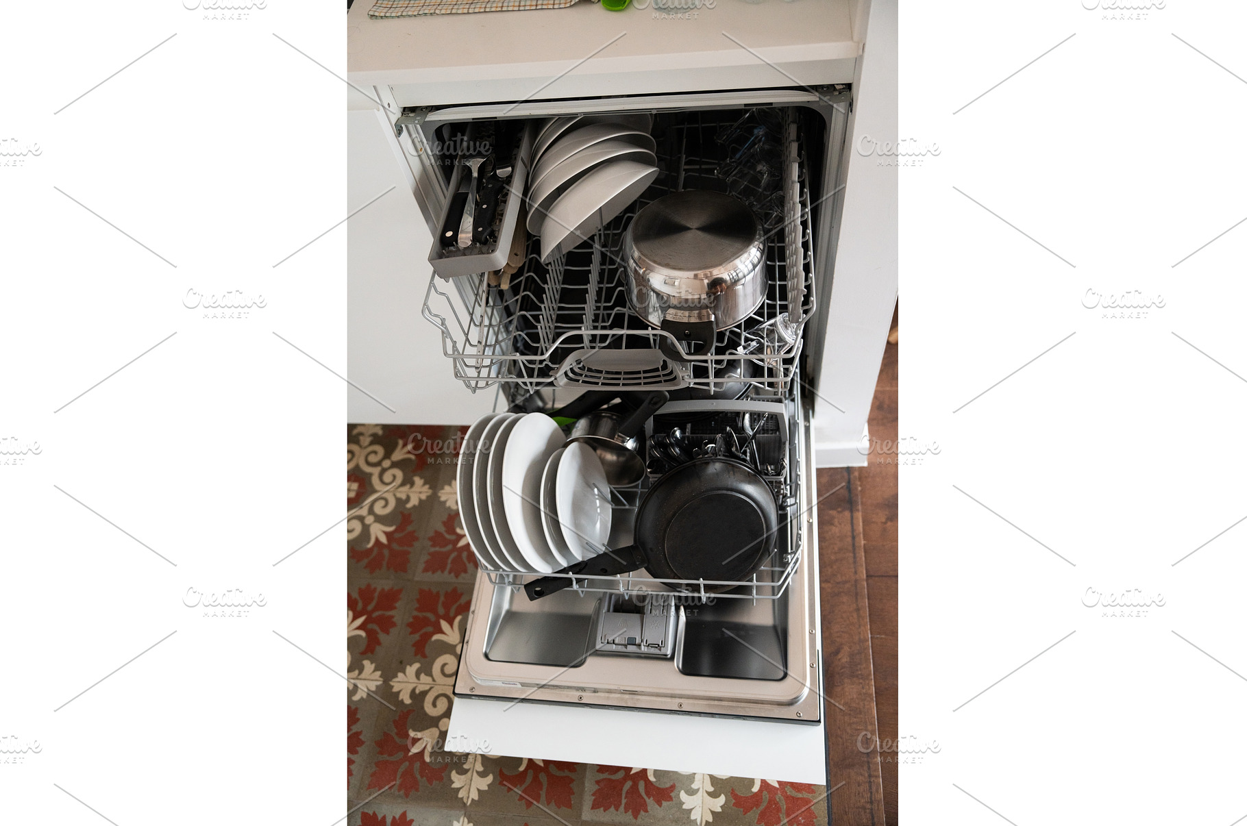 Fully loaded dishwasher featuring, a Technology Photo by volodymyrshtun13795