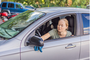 Woman cleaning her car, organizing, a Person Photo by Elizaveta Galitskaya