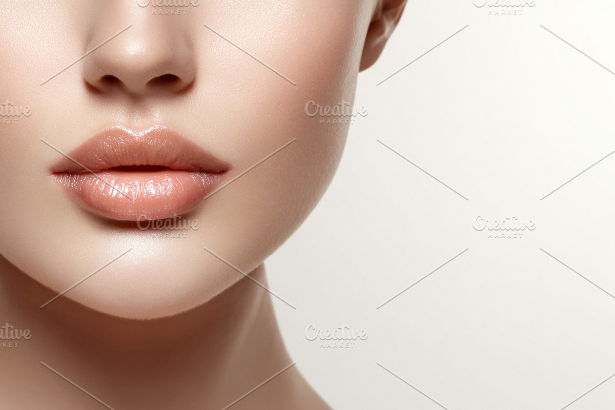 Woman's lower face with flawless skin and glossy nude lips, high, a Beauty & Fashion Photo by Studio ANNA (Photo 1 of 2)