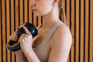 Kettlebell workout bodybuilder exercise female, a Person Photo by Photo Drive Studio