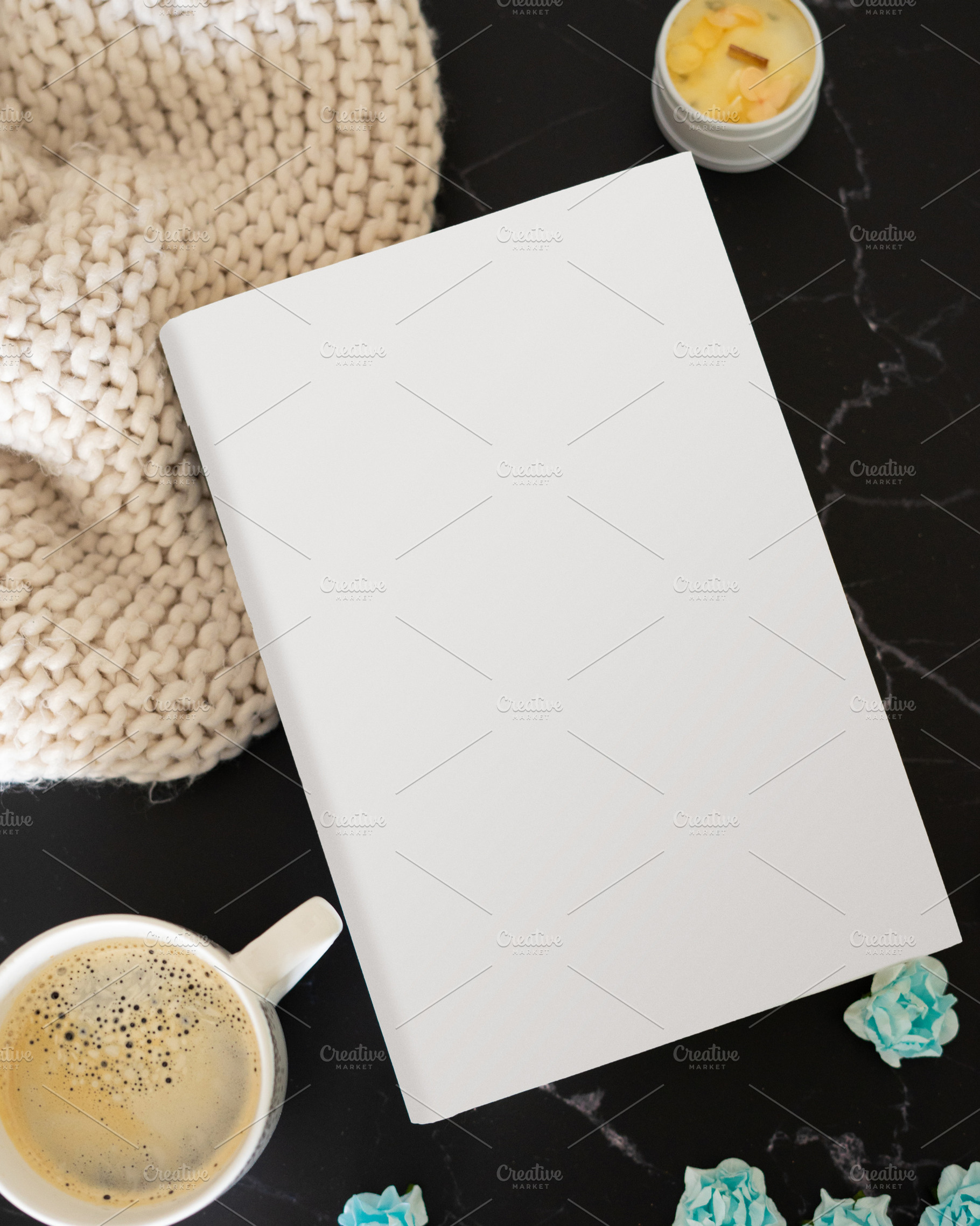 Mockup of a book with surrounding objects, a Background Photo by rubenchase