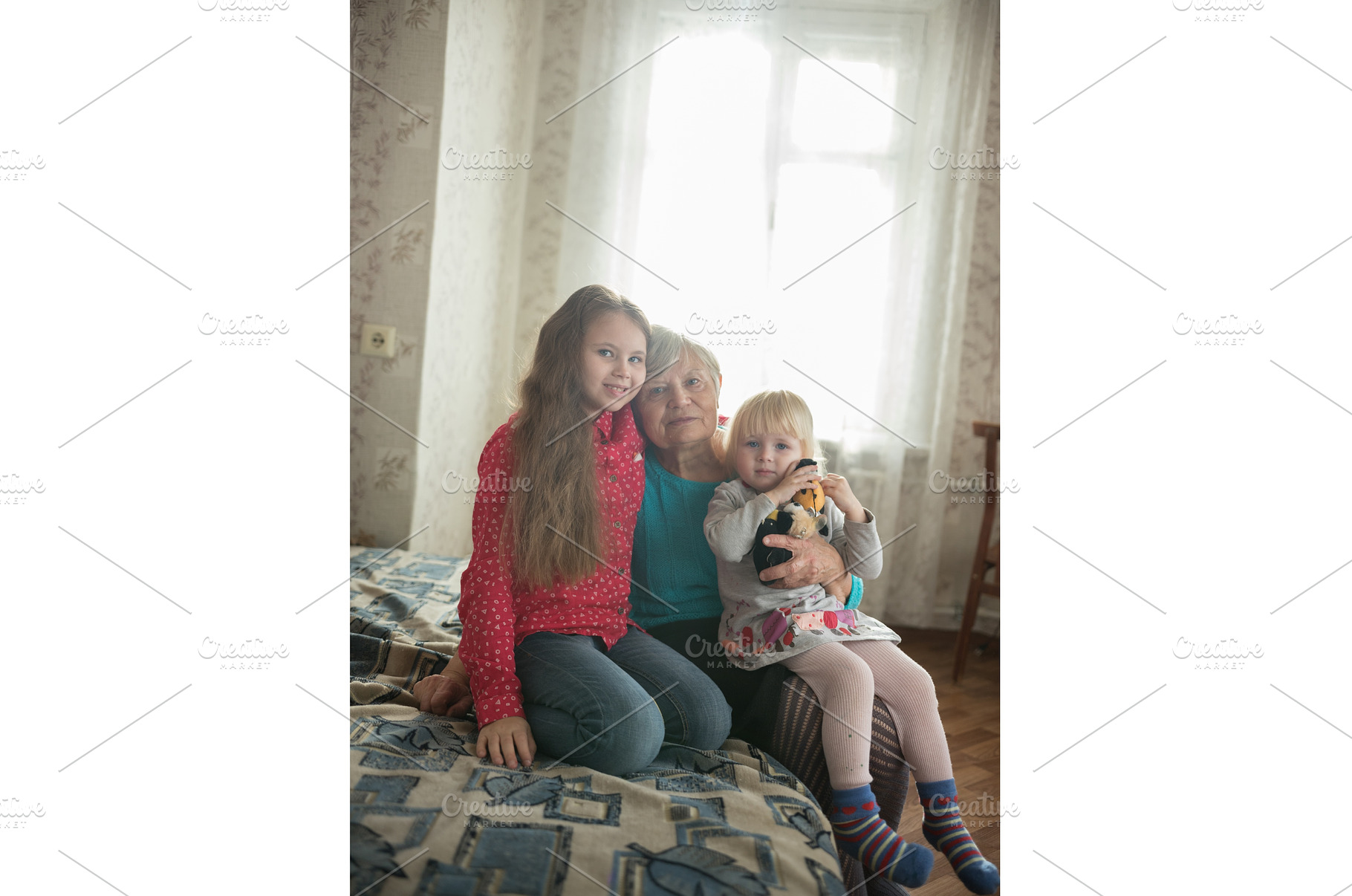 Happy family sitting on the bed. Two, a Person Photo by Barcelona_dreams