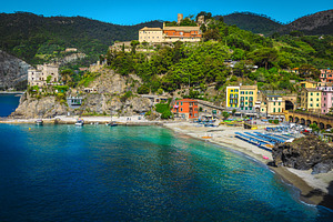 Ligurian beach and colorful houses, an Architecture Photo by Alpine Dreams