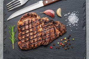 Grilled delicious ribeye steak, a Food & Drink Photo by Volff