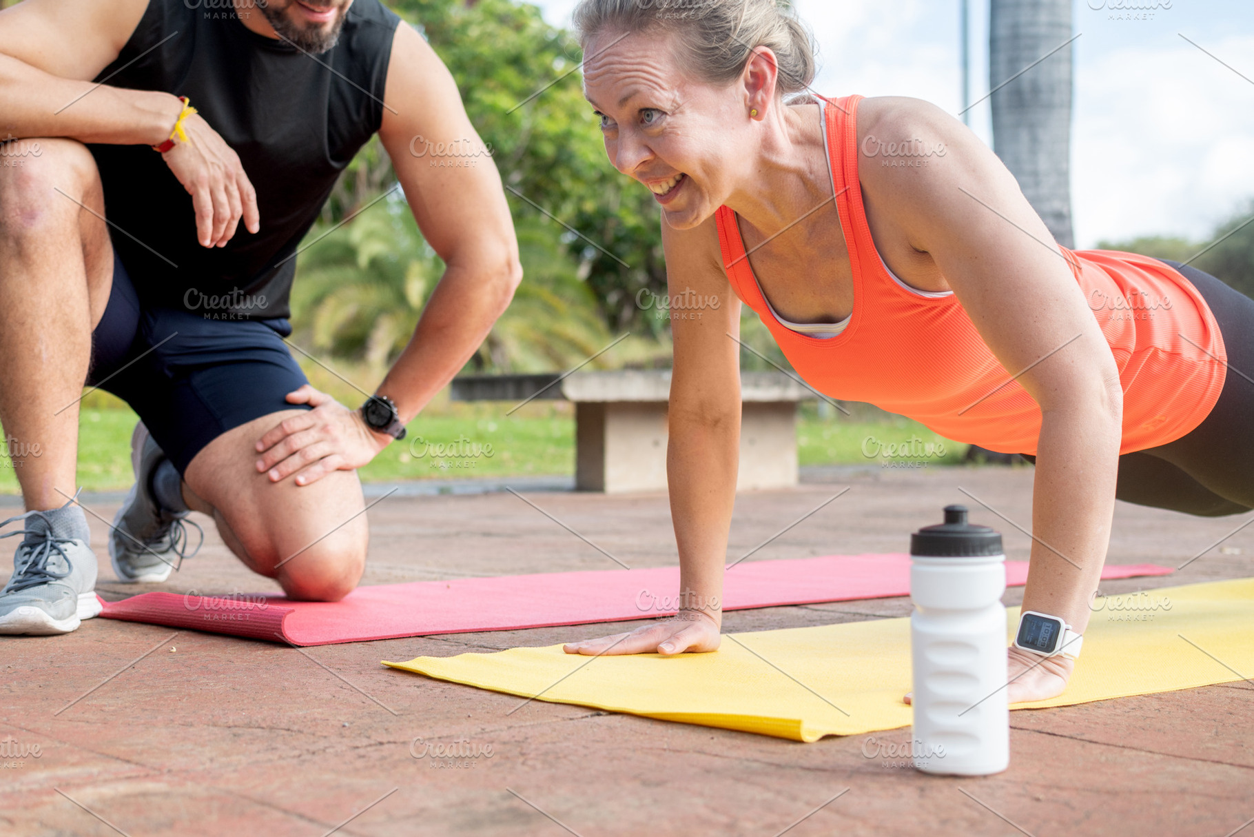 Woman doing push ups with personal trainer, a Sports & Recreation Photo by etorres69