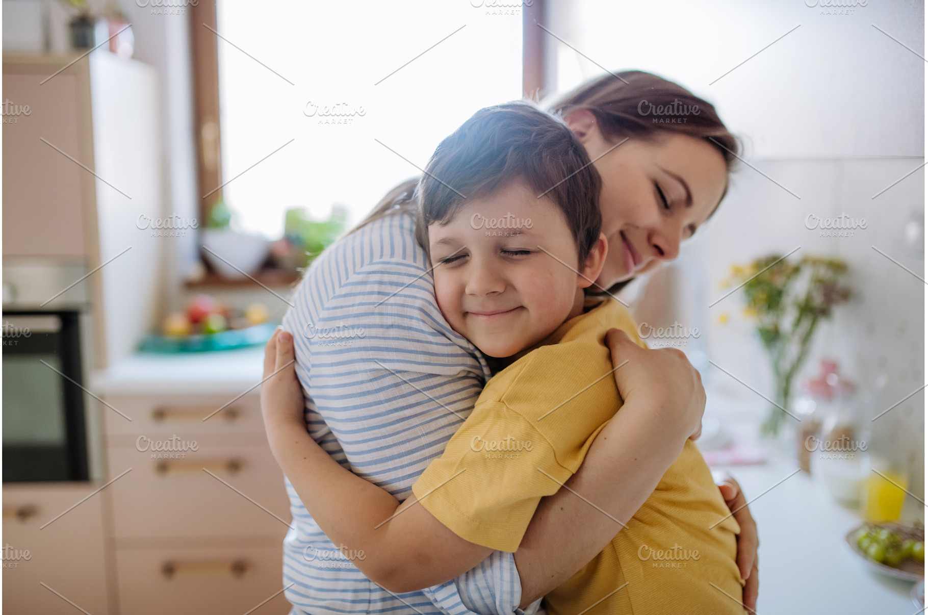 Happy oung mother hugging her little, a Person Photo by HalfPoint