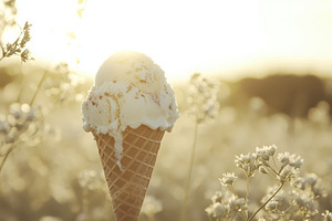 Delicious creamy ice cream cone melt, a Photo by Pavel_design