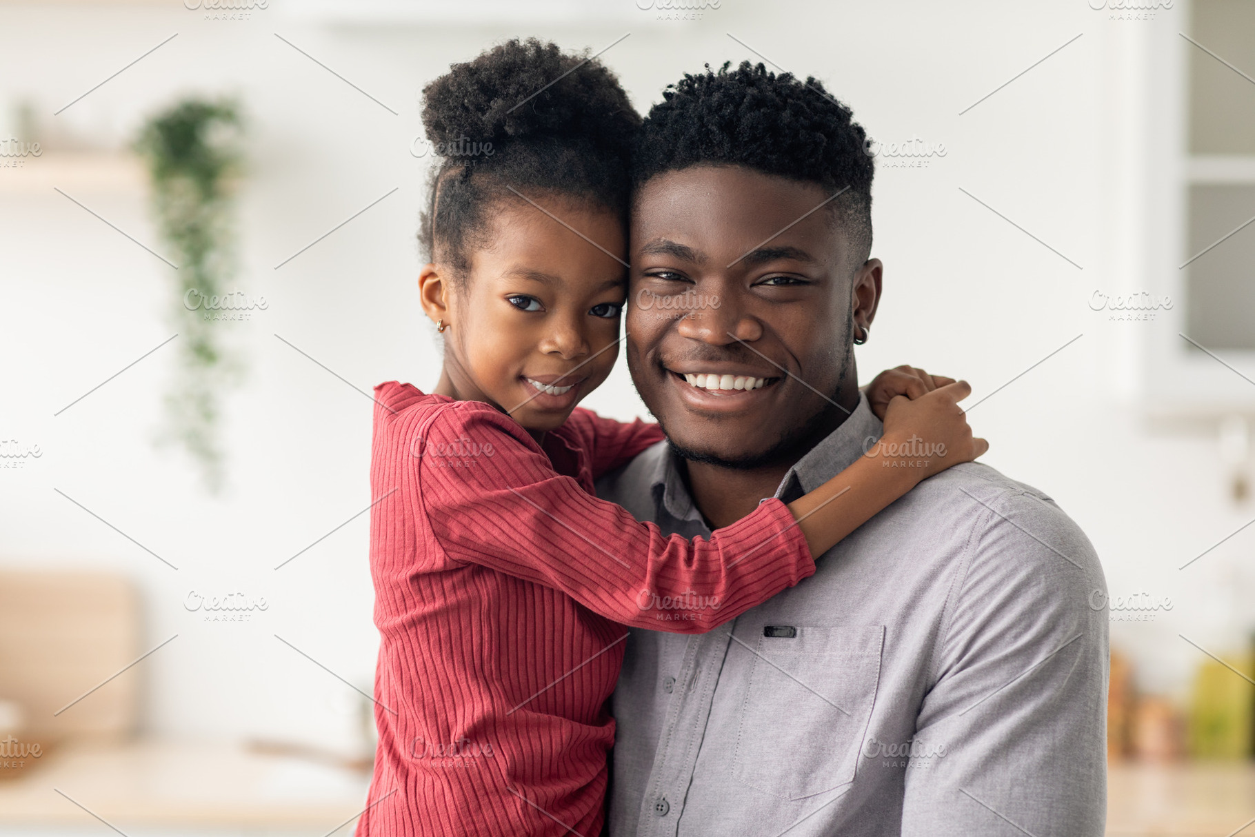 Portrait of cheerful black father and daughter smiling at camera, a Photo by Prostock-Studio