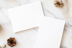 Two blank white greeting cards mockups with pine cones and festive ornaments on, a Holiday Photo by Studio ANNA