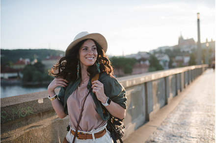 Young beautiful female traveler with, a Person Photo by HalfPoint