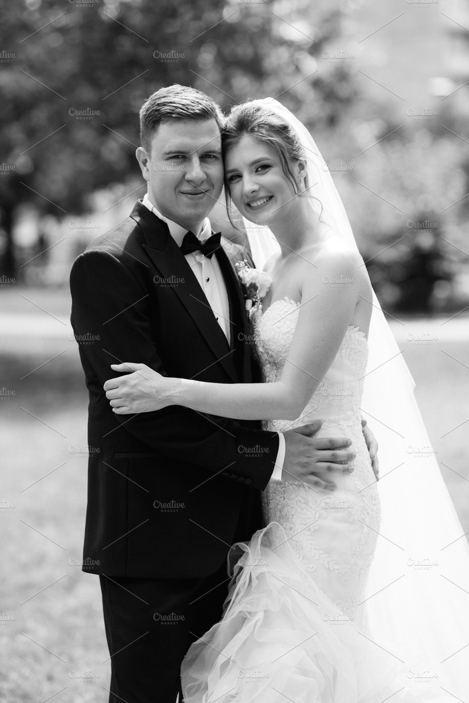 the groom in a brown suit and the bride in a white dress, a Person Photo by Weddings, People, Travel
