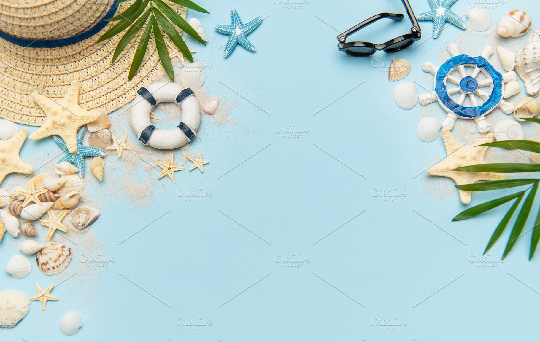 Summer vacation accessories creating a frame on blue background, a Holiday Photo by Olena Rudo