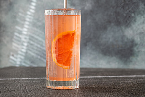 Refreshing pink Paloma cocktail with grapefruit ice bubbles and, a Food & Drink Photo by Alexander Prokopenko