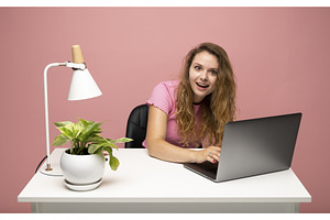 Surprised young woman working on, a School & Education Photo by volodymyrshtun13795