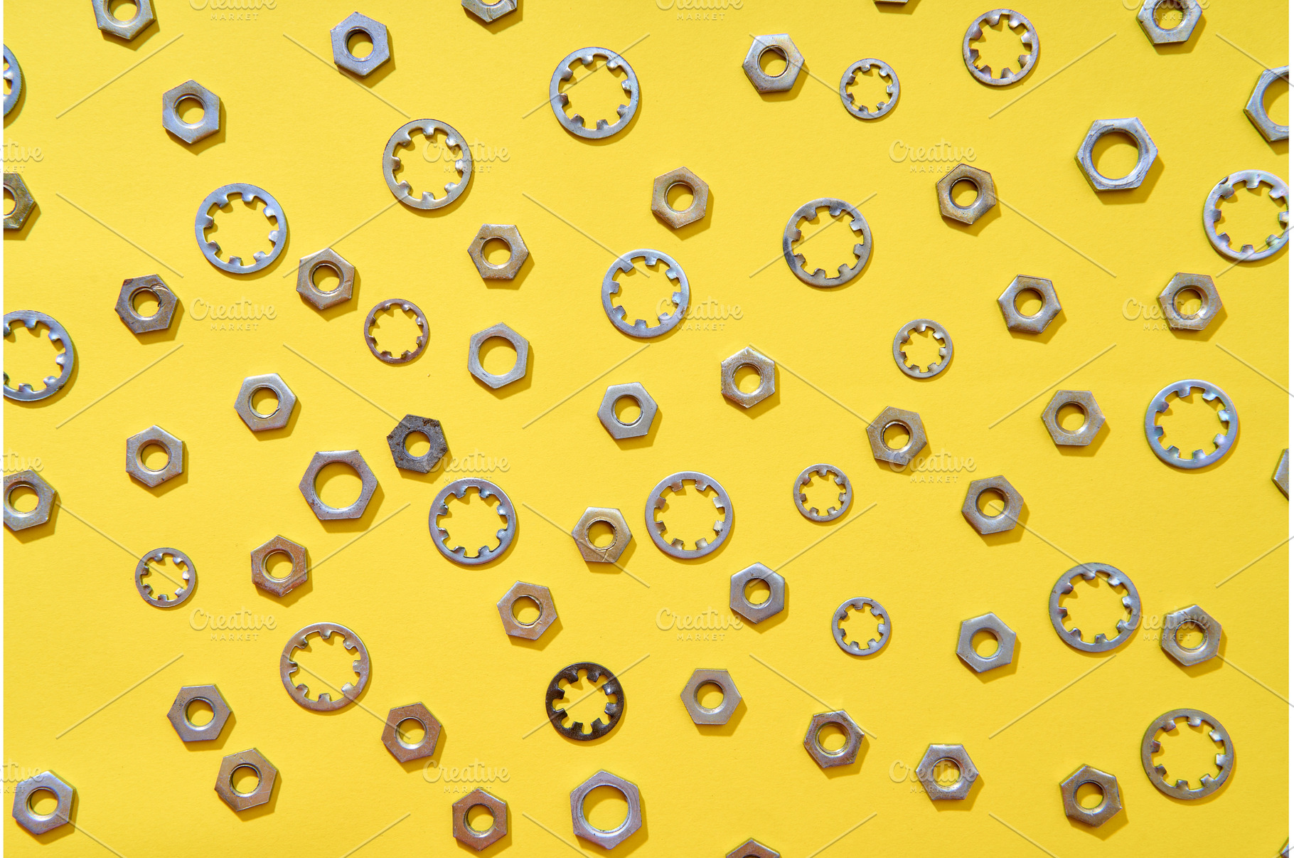 Mixed washers and nuts pattern over, an Industrial Photo by Gladkov photography