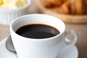 Black coffee with croissants and butter, a Food & Drink Photo by etorres69