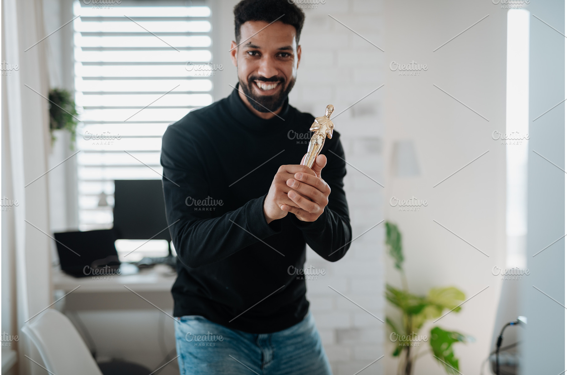 Happy man proudly holding a trophy., a Person Photo by HalfPoint