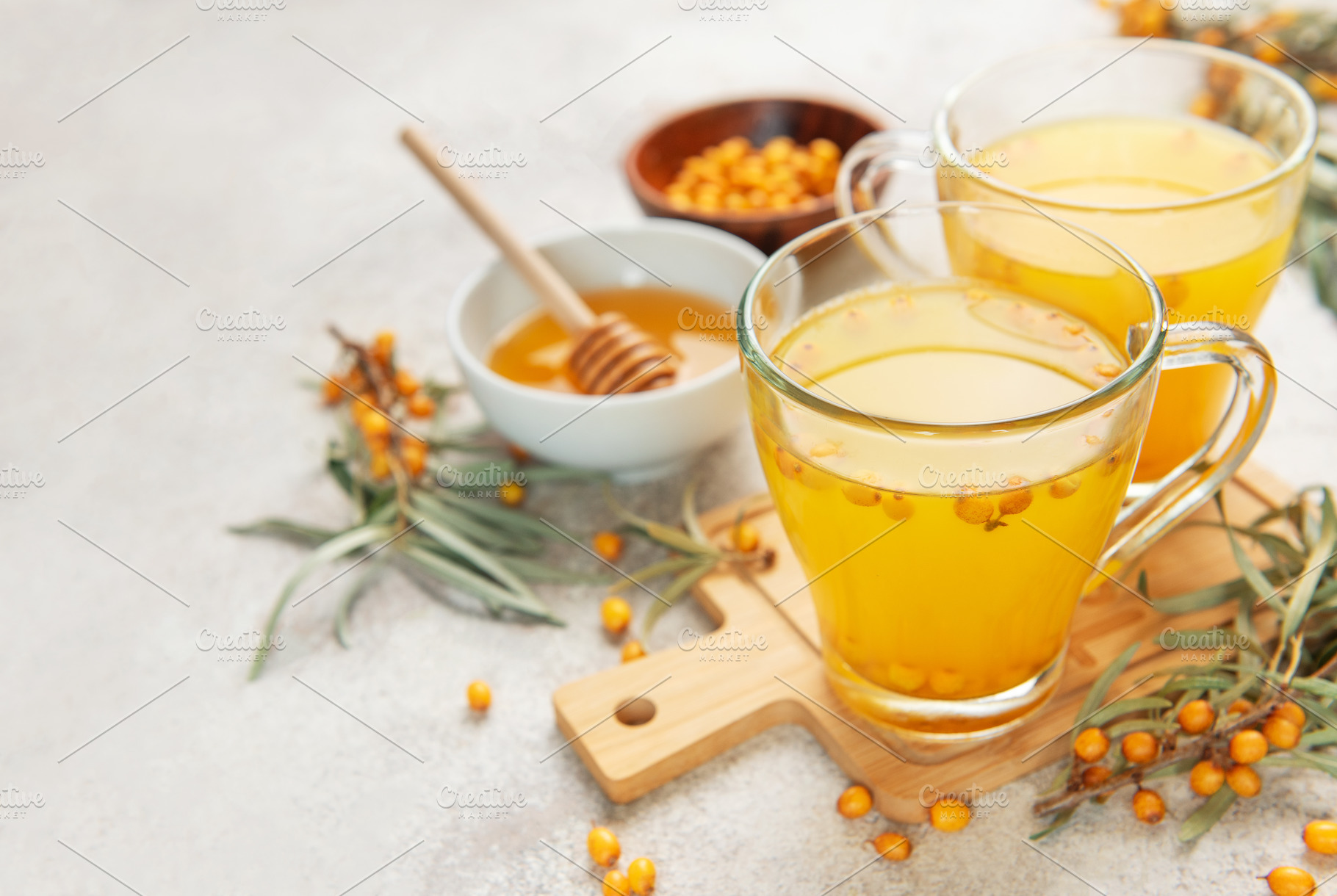 Sea buckthorn berry tea preparing a healthy drink, a Food & Drink Photo by Olena Rudo