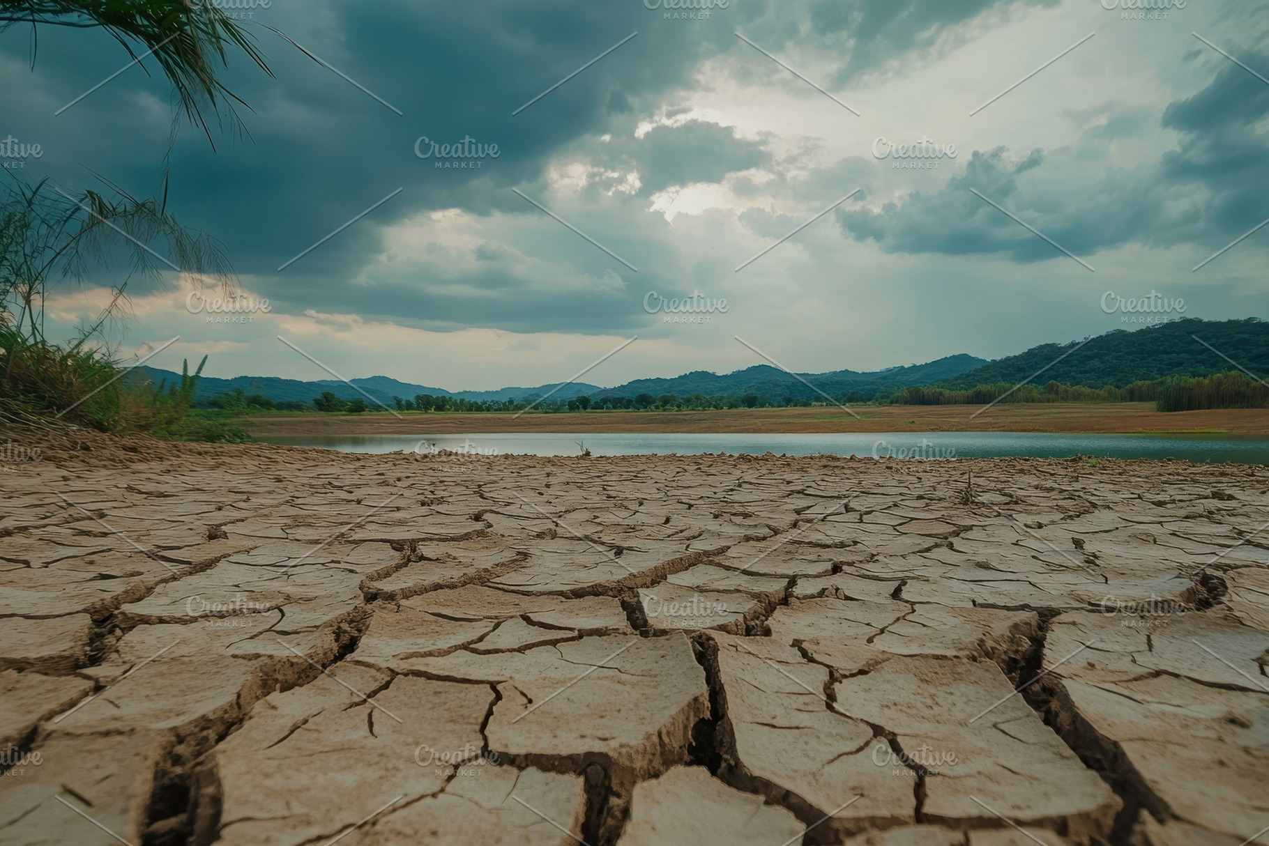 Dry cracked soil in a barren landsca, a Photo by Iftikhar Alam