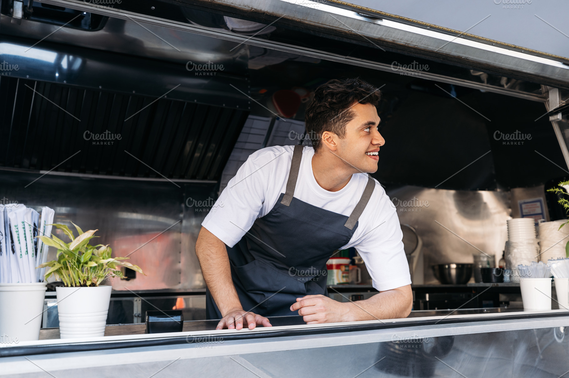 Confident chef in food truck, a Business Photo by Artem Varnitsin