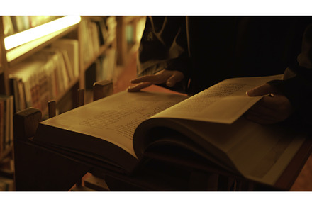 Man reading large mysterious book, a School & Education Photo by Media Whale Stock