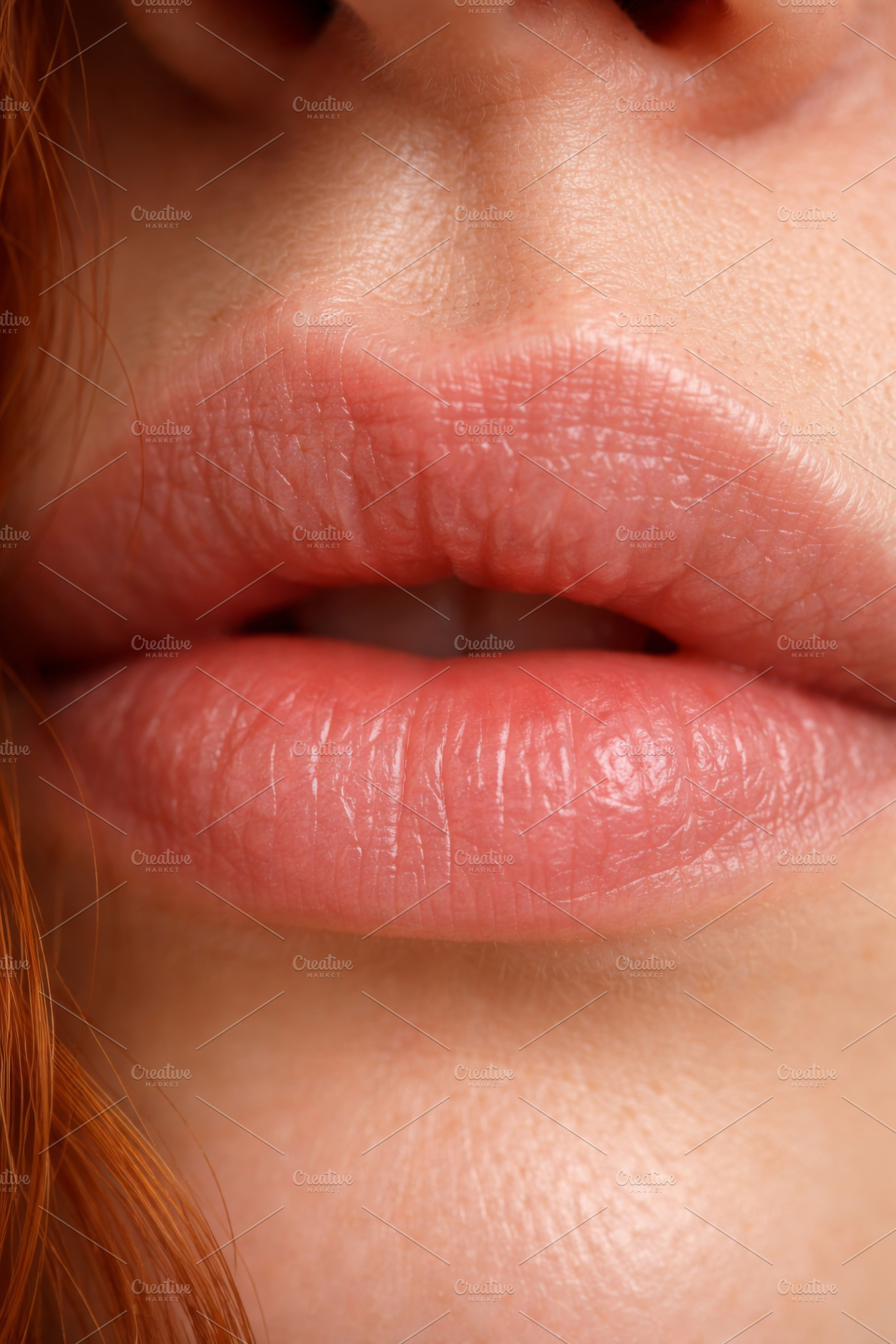 Macro close-up of female lips, detai, a Photo by Dvoevnore photos