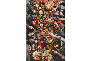 People eating and pouring wine at
